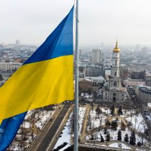 A Ukrainian national flag waves over the center of Kharkiv, Ukraine's second-largest city, Wednesday, Feb. 16, 2022, just 40 kilometers (25 miles) from some of the tens of thousands of Russian troops massed at the border of Ukraine, feels particularly perilous. As Western officials warned a Russian invasion could happen as early as today, the Ukrainian President Zelenskyy called for a Day of Unity, with Ukrainians encouraged to raise Ukrainian flags across the country. (AP Photo/Mstyslav Chernov)